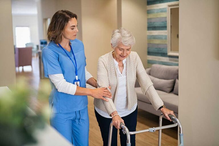 Family members review a care checklist with an older adult at a bright kitchen table.